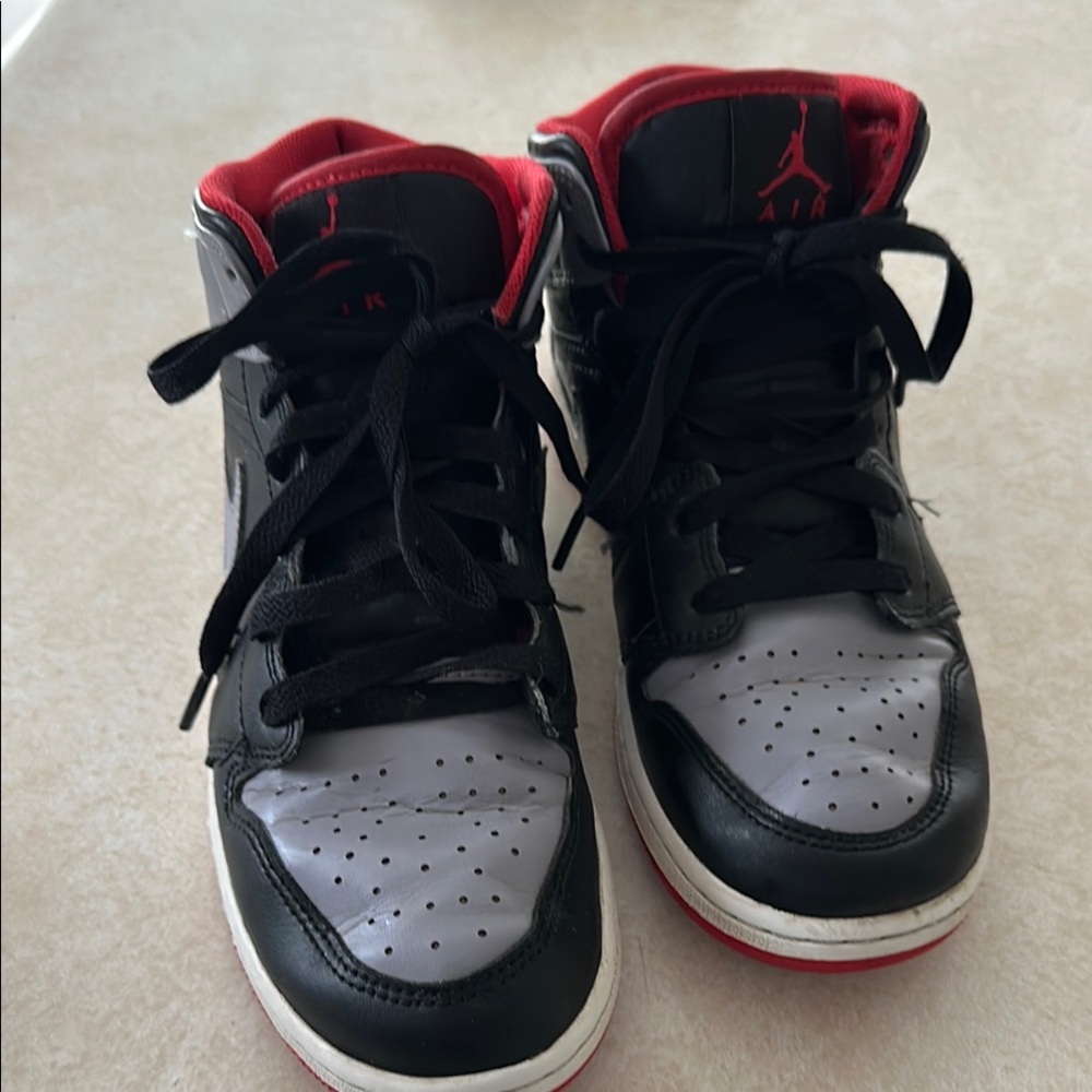 Kids Jordan Black and Red Sneakers